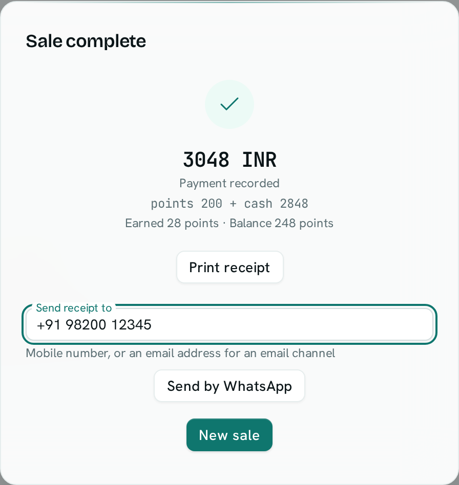 The Sale complete window after a sale to a customer who paid part with loyalty points, showing points earned, the new balance and a Send by WhatsApp button